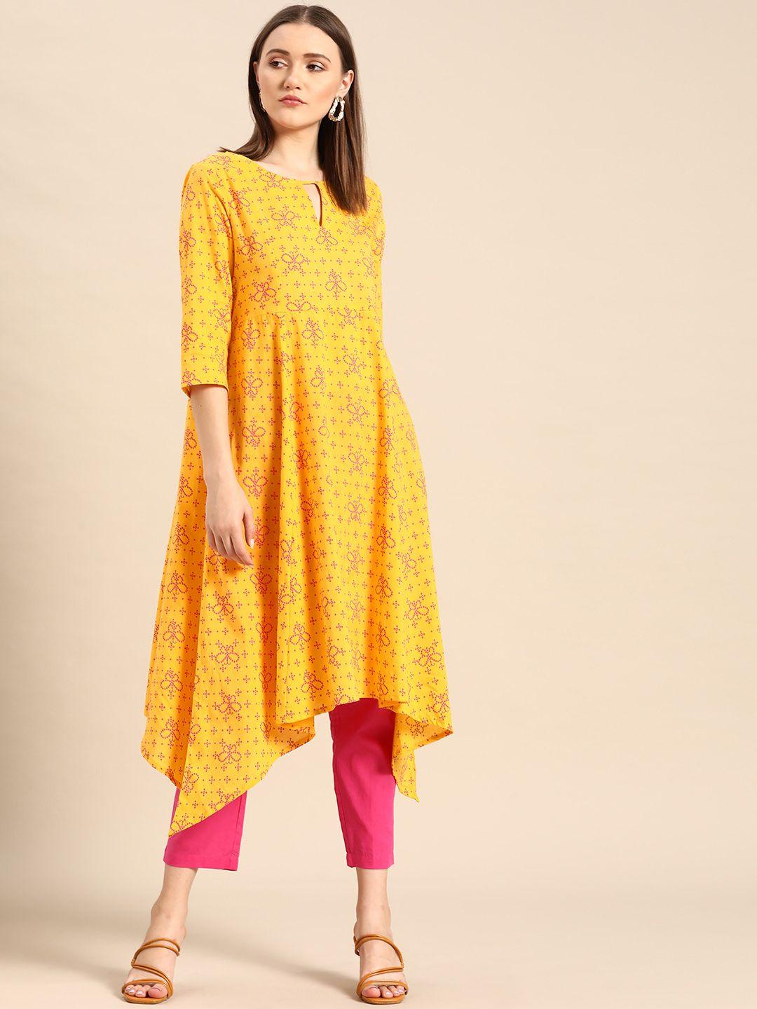 anouk women yellow printed regular asymmetric pure cotton kurta with trousers