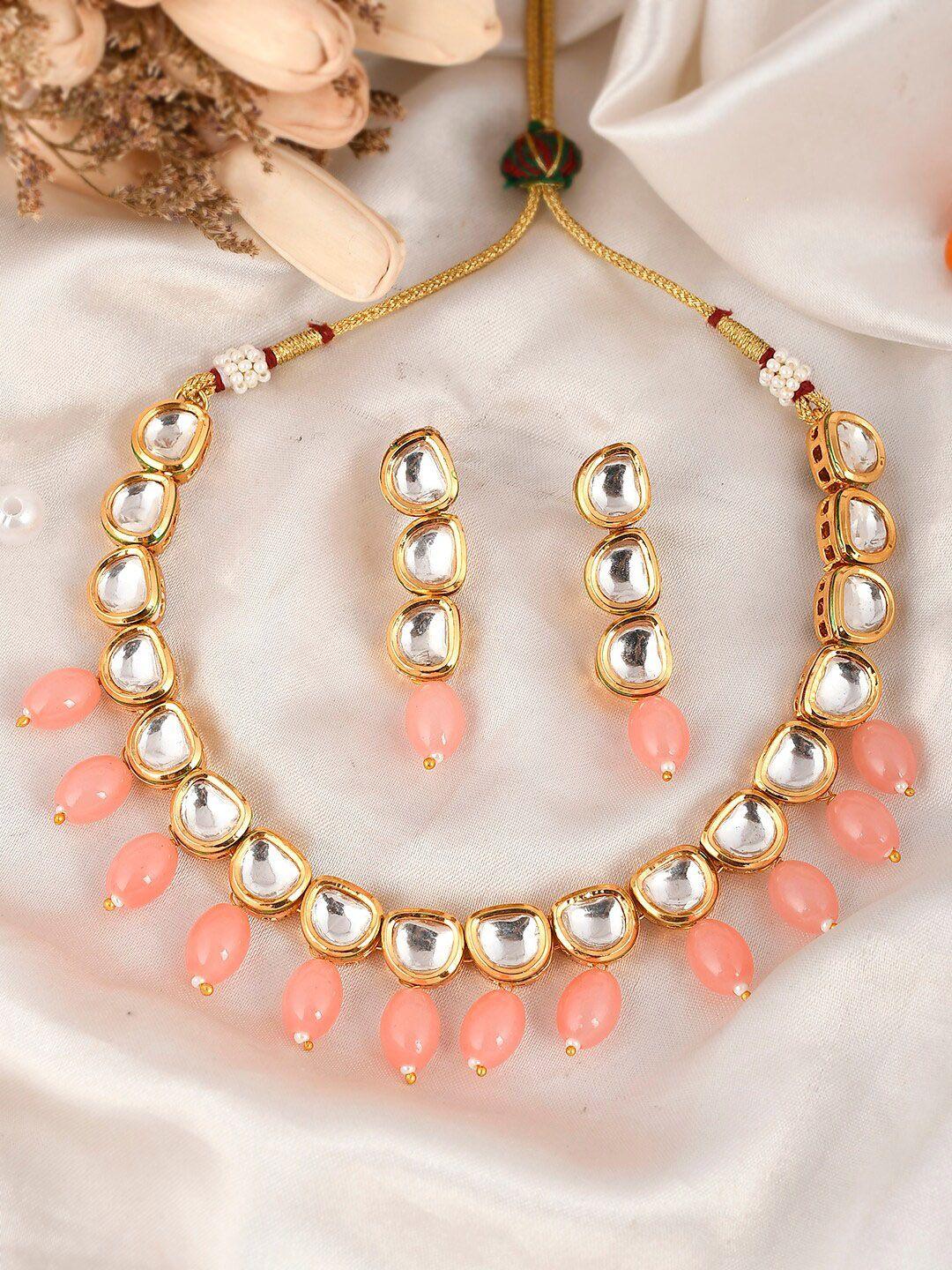 aquastreet jewels gold-plated peach-coloured kundan stone-studded jewellery set