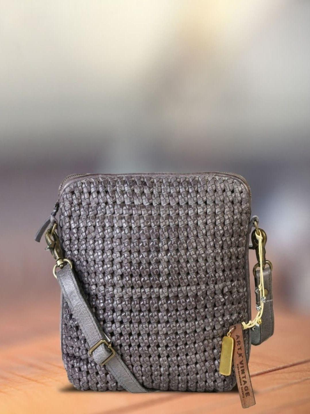 art n vintage textured leather structured sling bag with tasselled