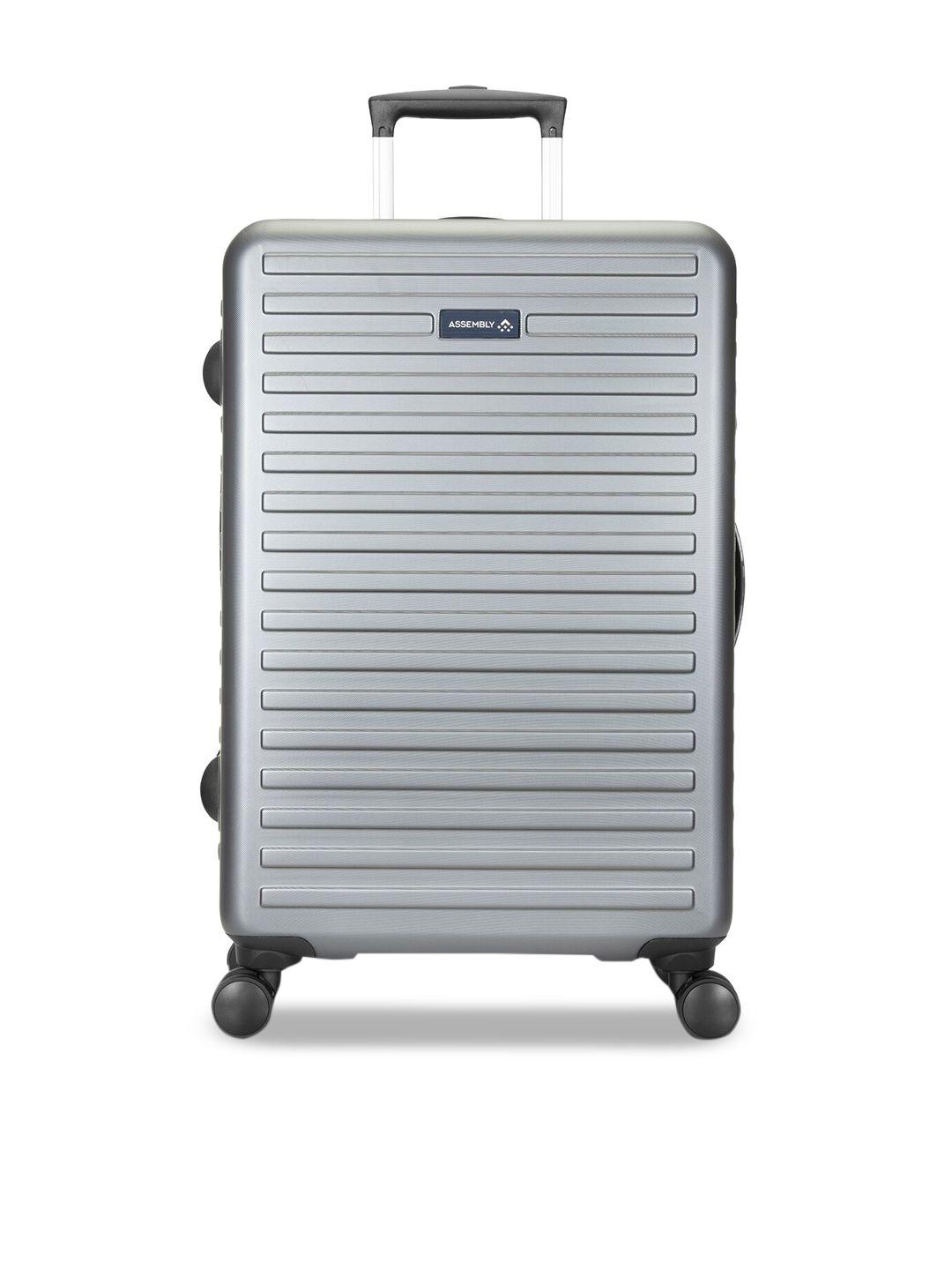 assembly grey textured large hard luggage trolley bag