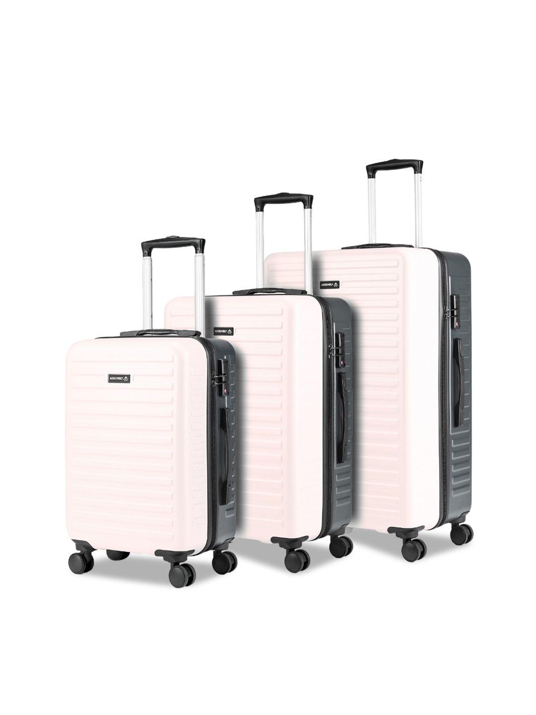 assembly set of 3 textured hard-sided trolley suitcases