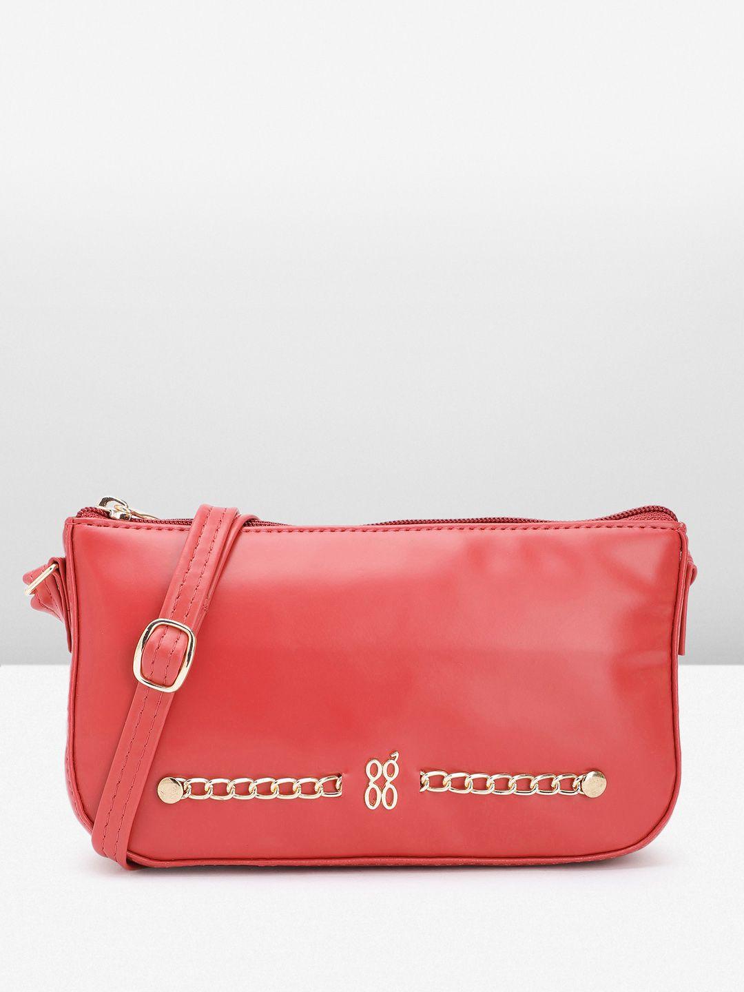 baggit solid structured sling bag with link chain embellishment detail