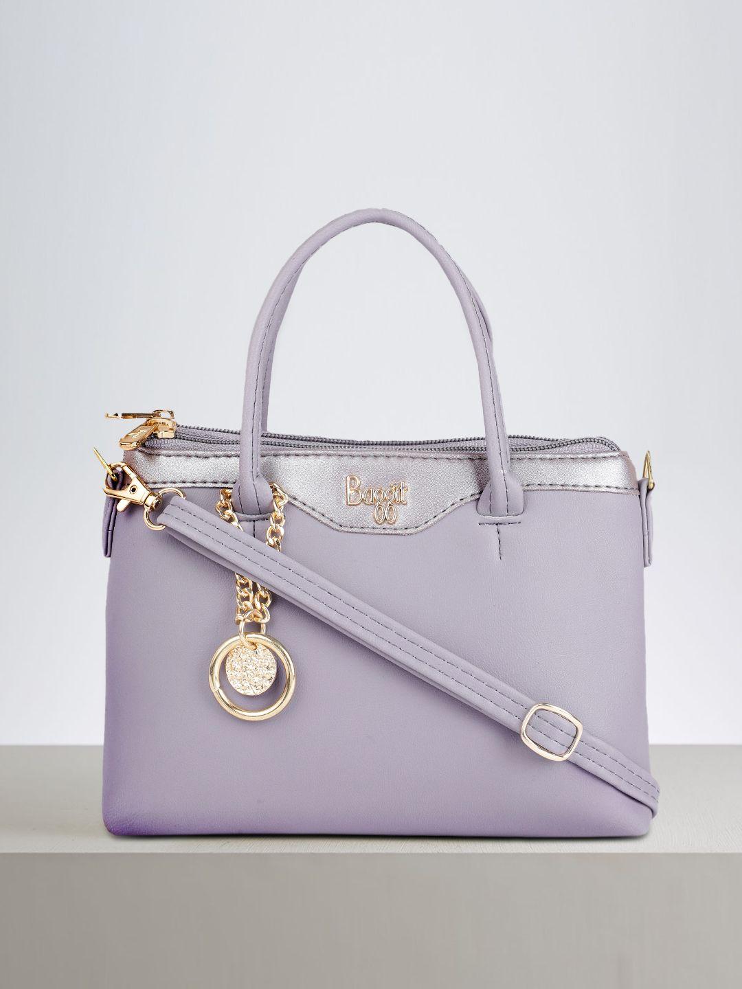 baggit violet solid regular structured handheld bag with tasselled detail