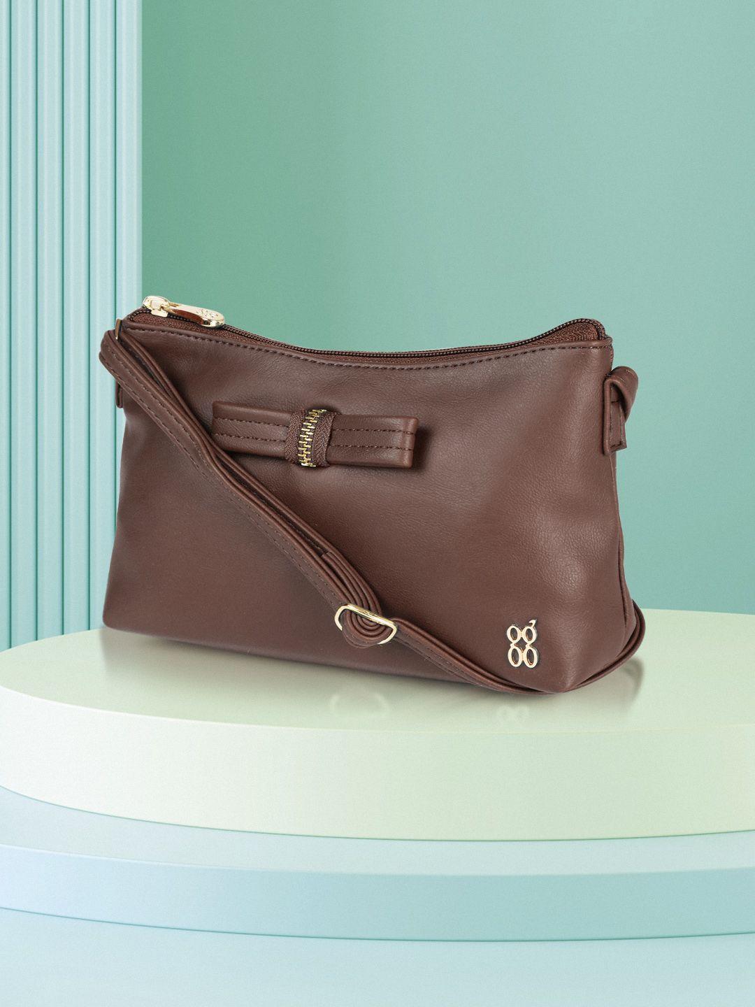 baggit women brown solid sling bag with bow detail