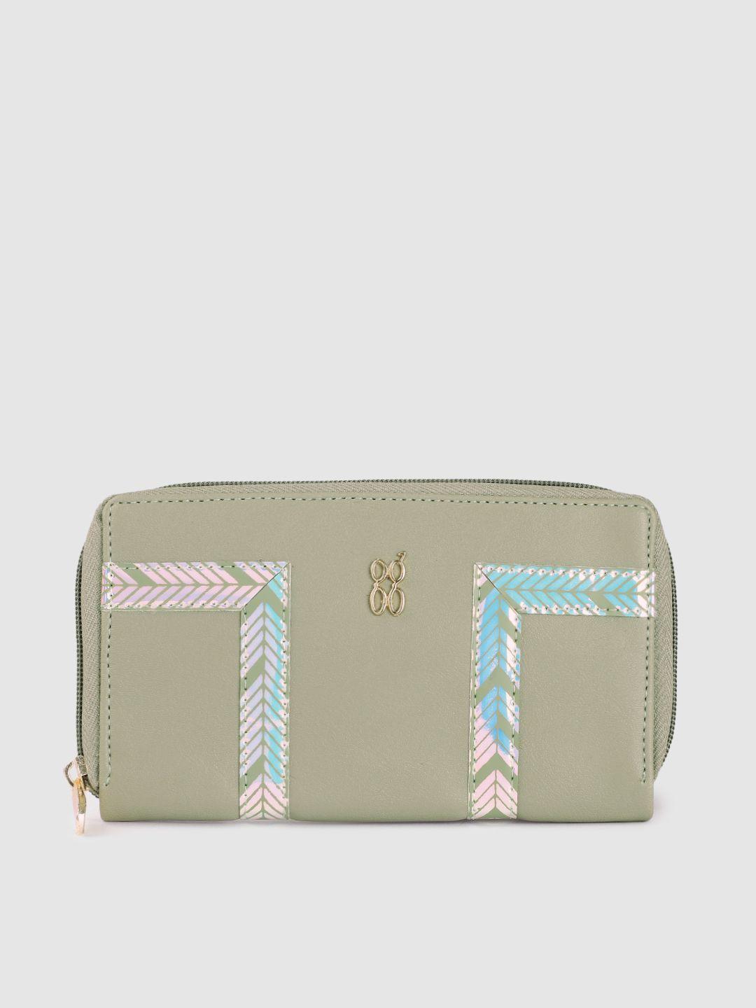 baggit women mint green reflective print zip around wallet