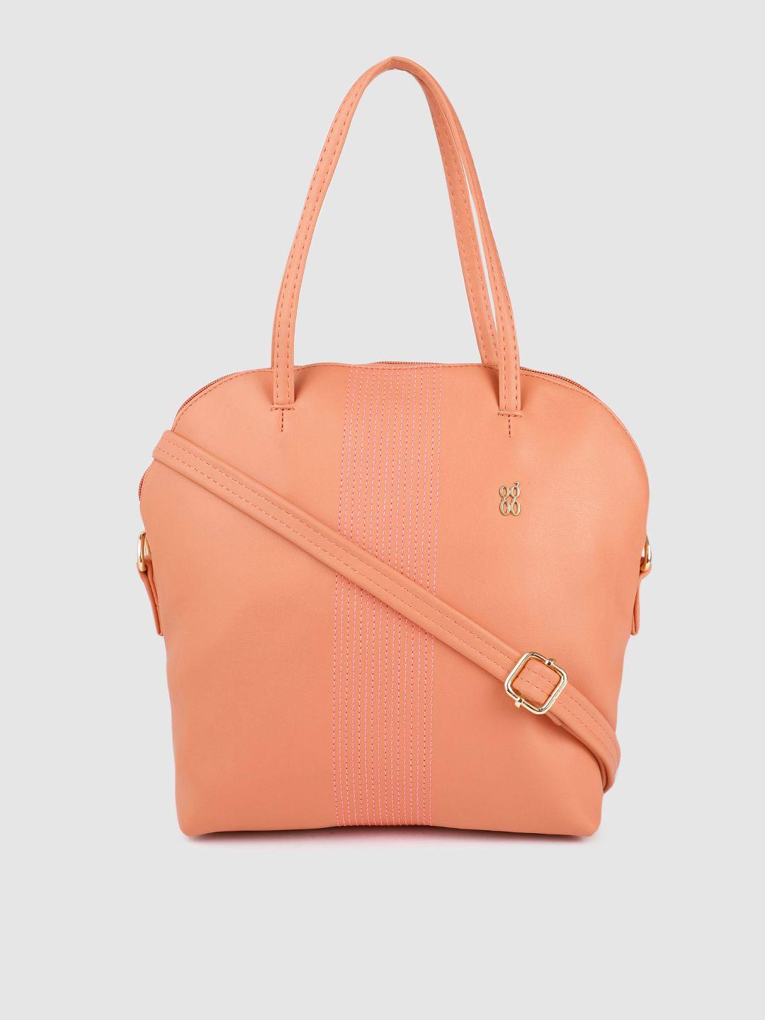 baggit women peach-coloured solid structured handheld bag