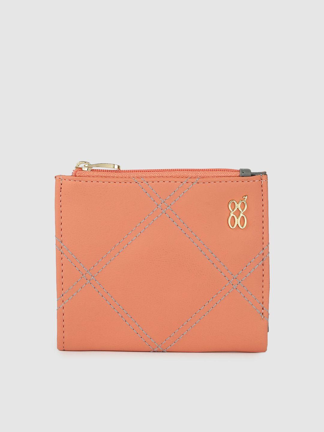 baggit women peach orange solid quilted two fold wallet