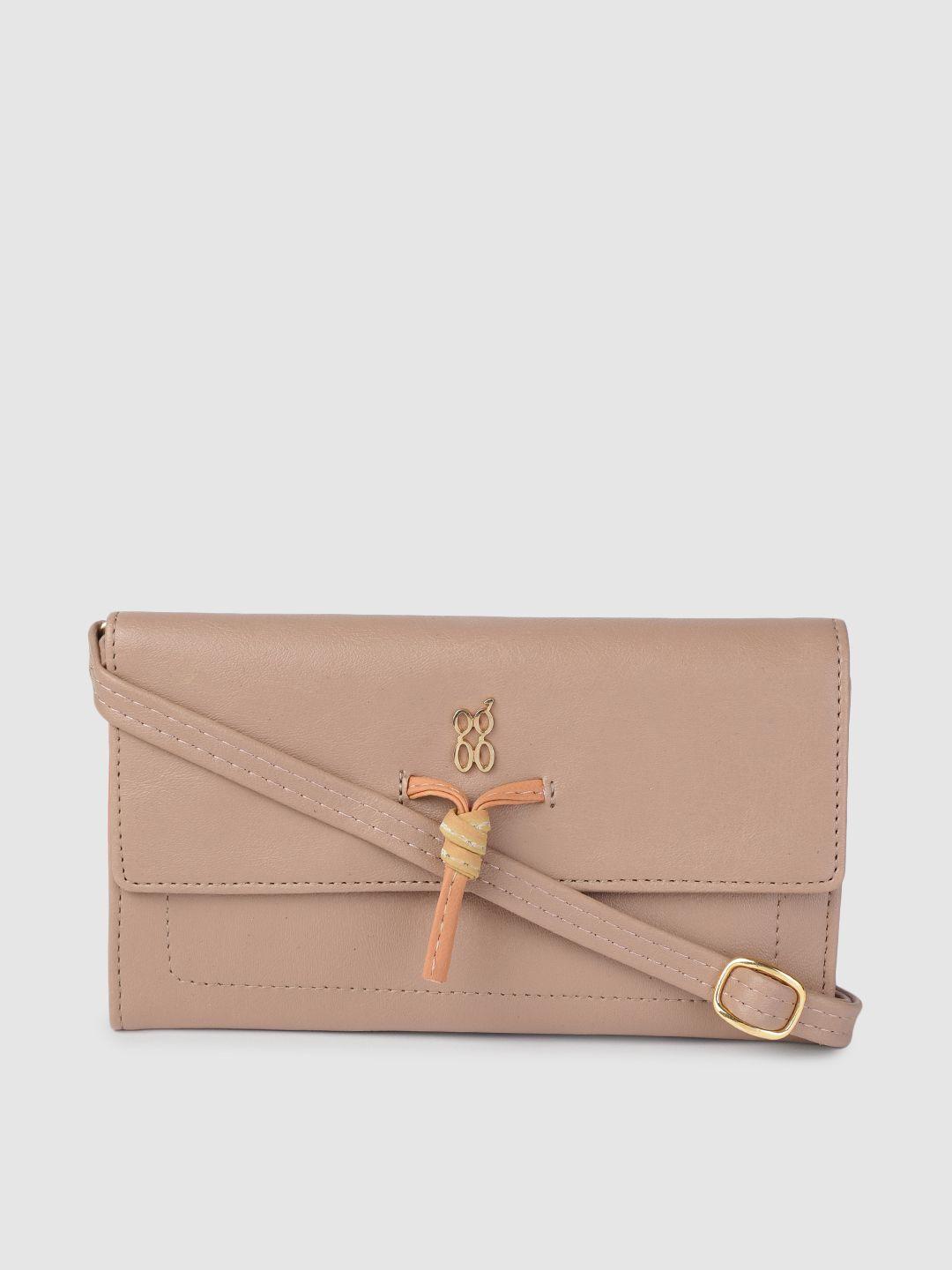 baggit women pink solid envelope wallet with sling strap