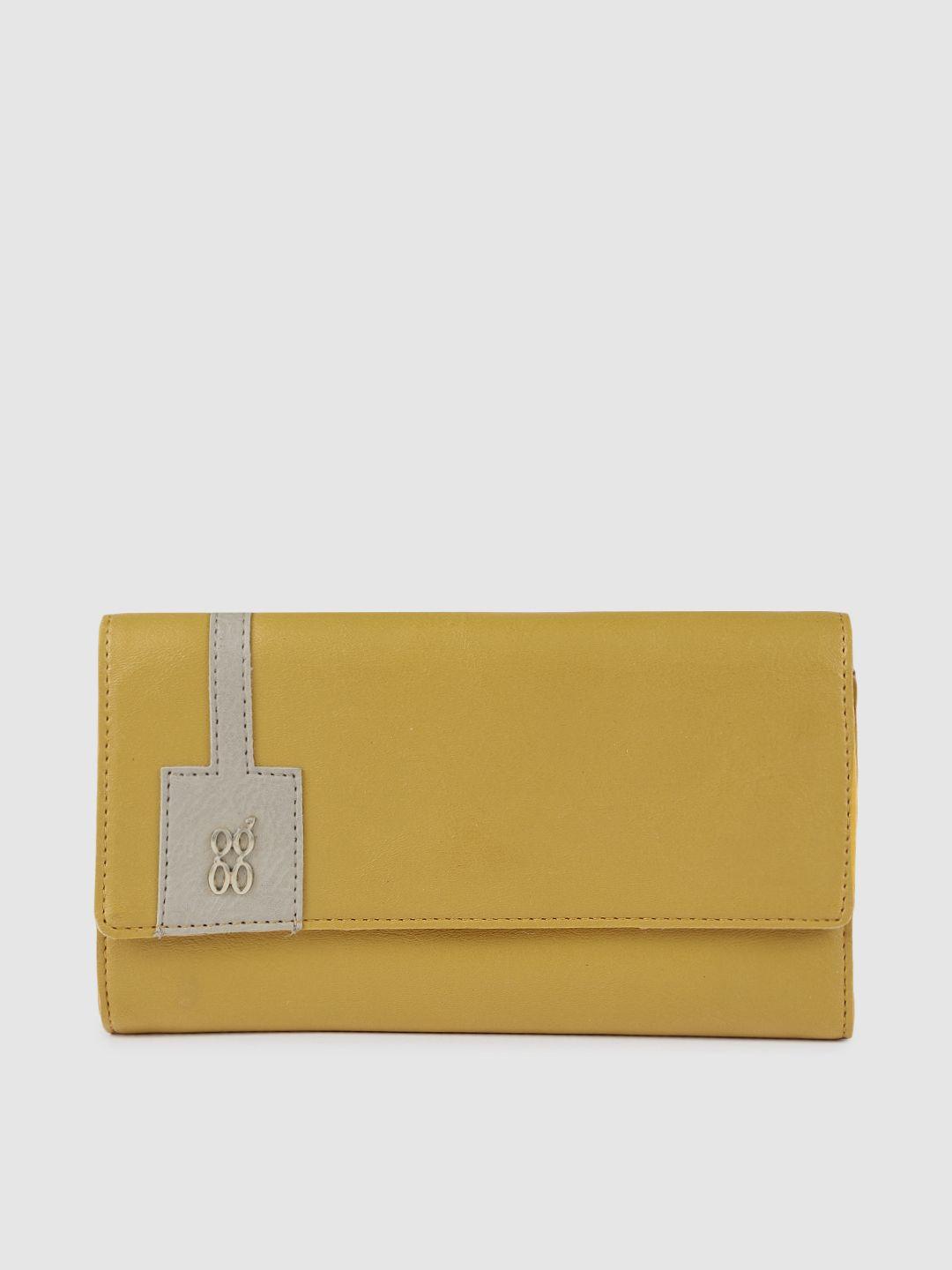 baggit women yellow solid three fold wallet