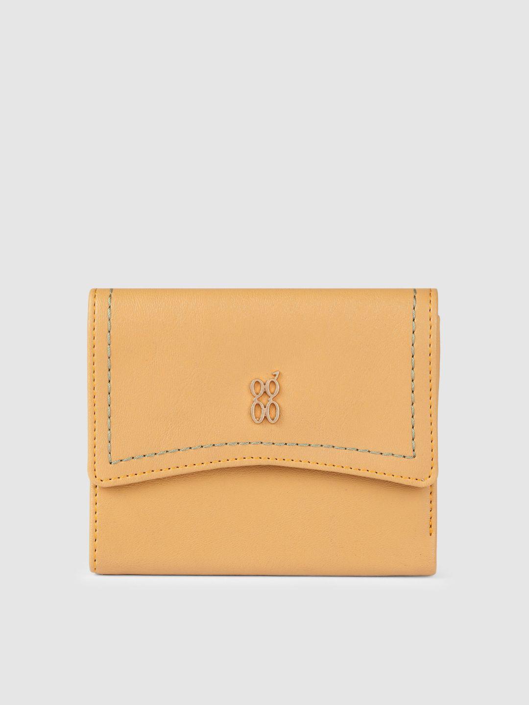 baggit women yellow solid three fold wallet