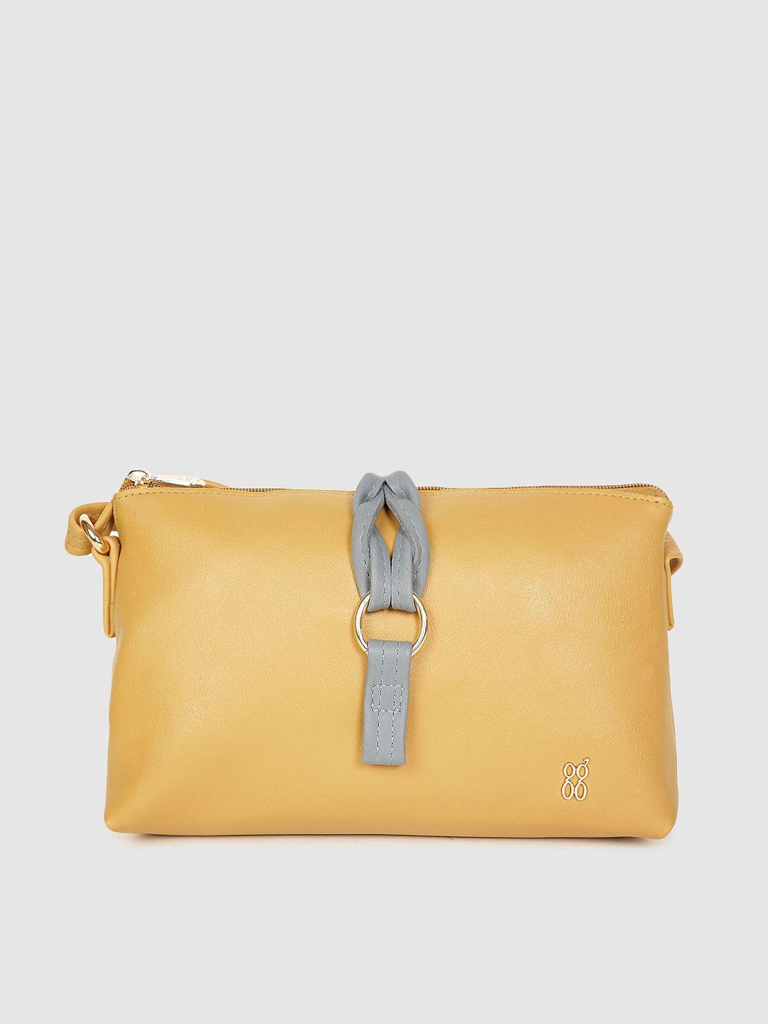 baggit yellow solid regular structured sling bag with buckle detail