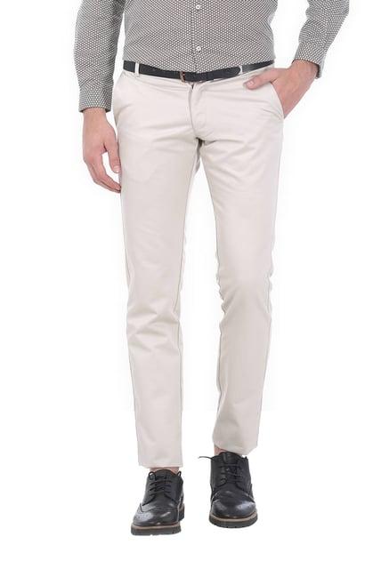 basics ecru solid low rise tapered fit trousers