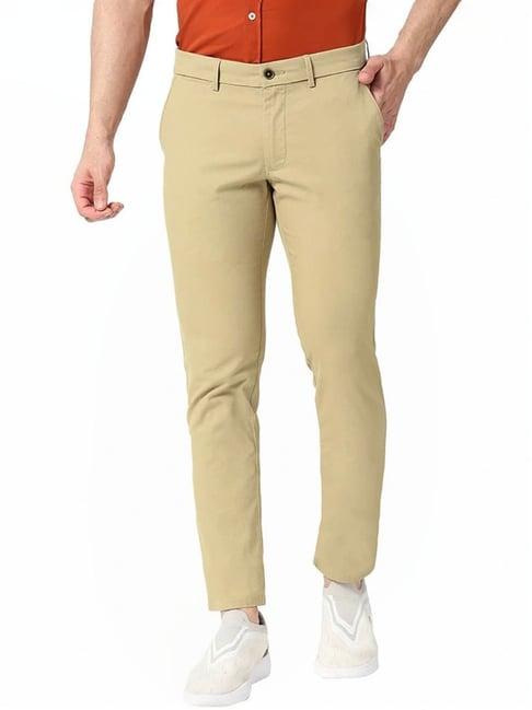 basics green tapered fit trousers