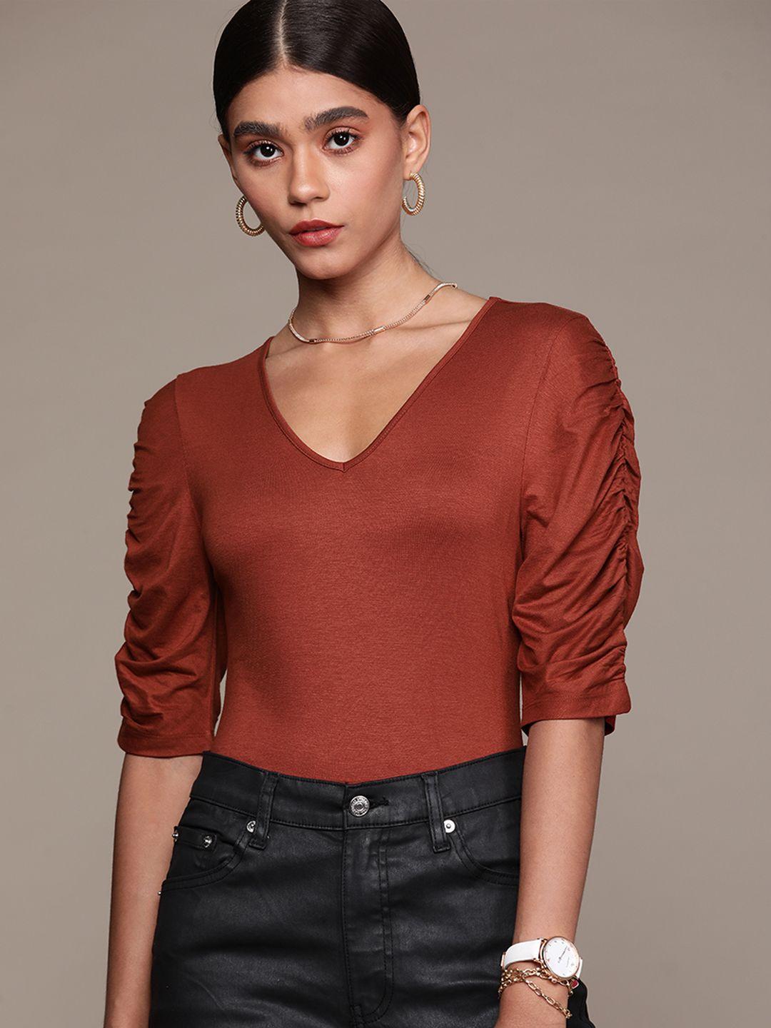 bebe women rust am-pm solid puff sleeves regular top