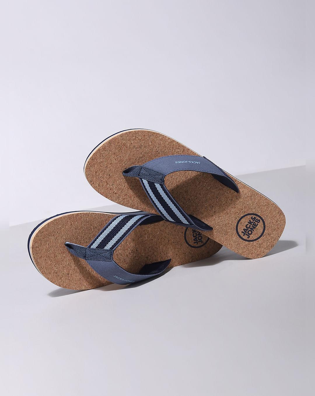 beige and blue flip flops