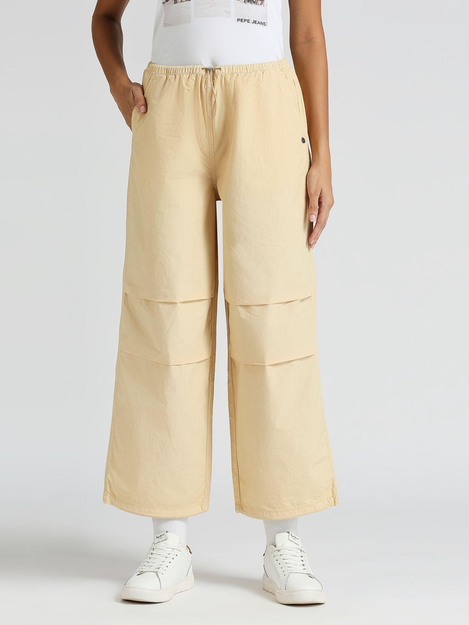 beige dale solid parachute pants with knee pleats