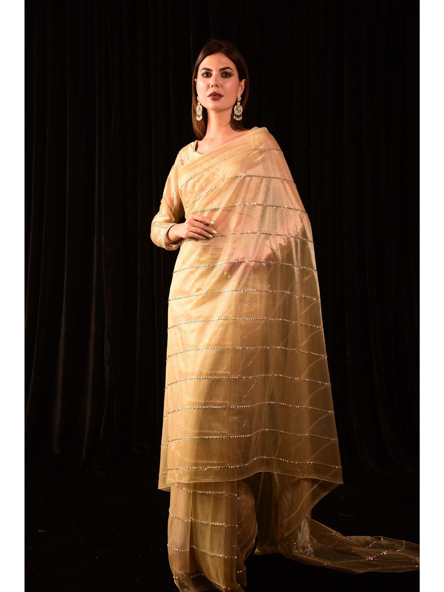 beige gold tissue embellished saree with stitched blouse