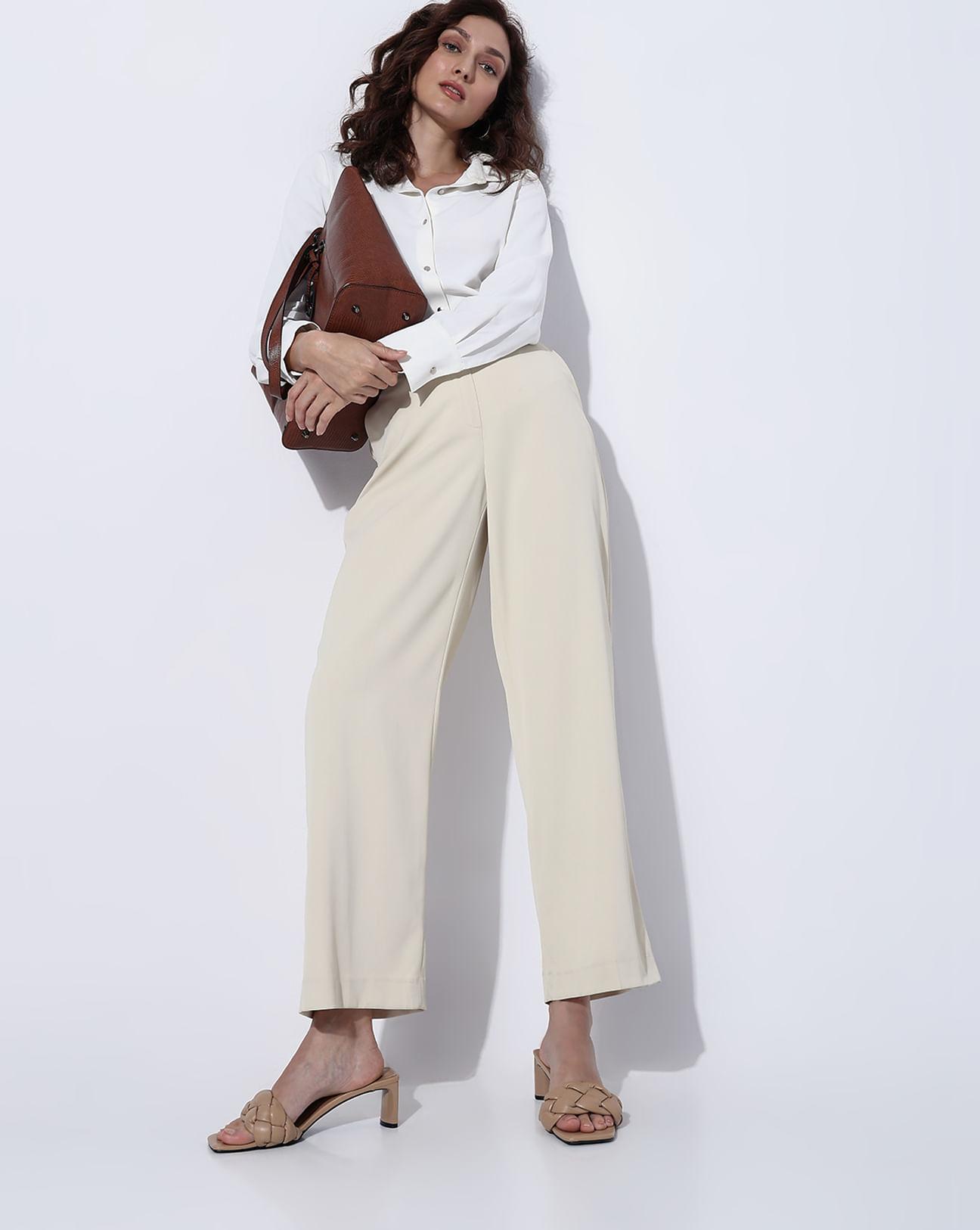 beige high rise flared pants