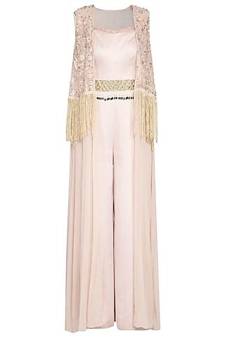 beige jumpsuit with embroidered cape and belt