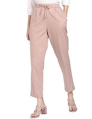 beige mid rise solid trousers