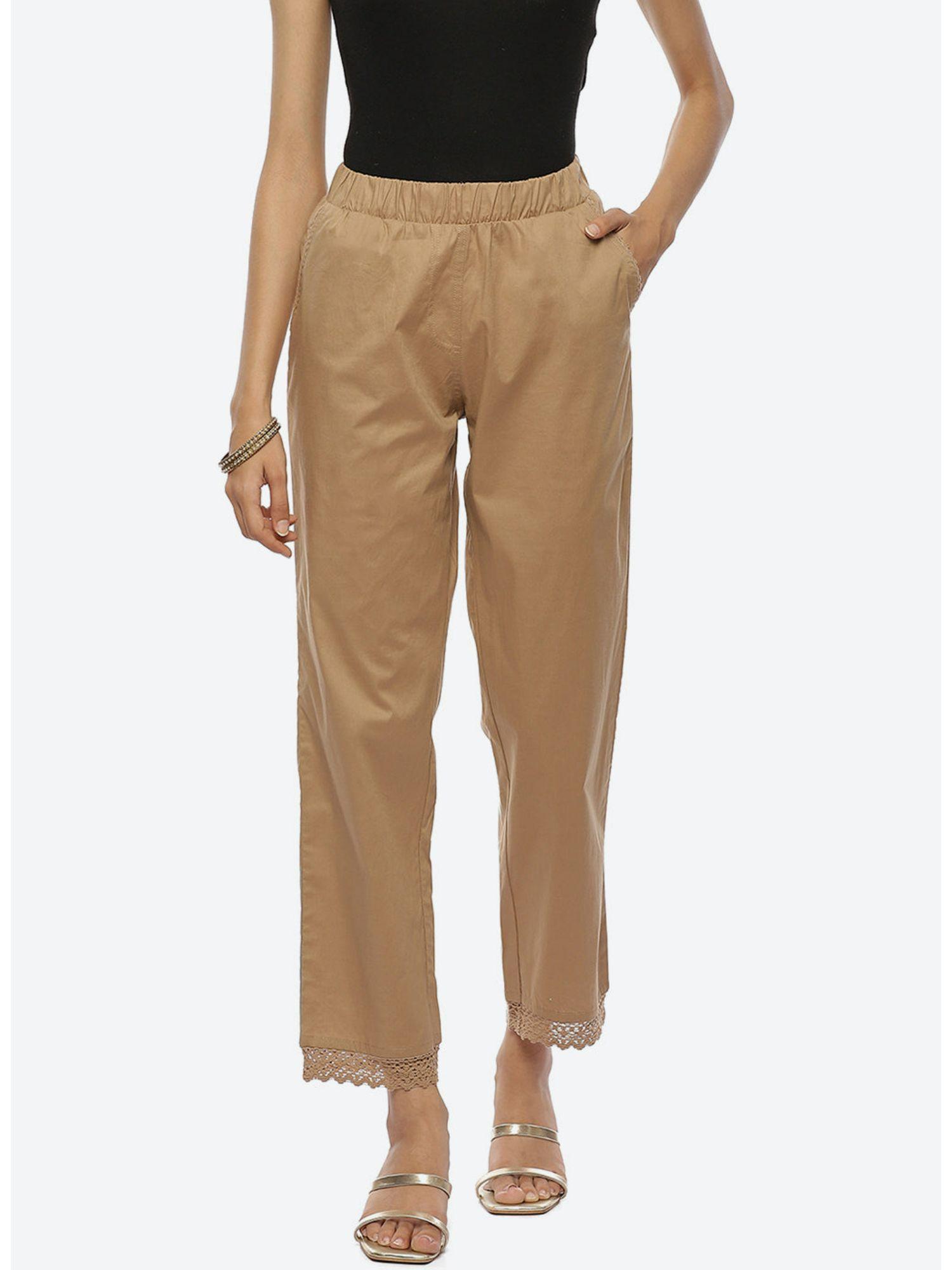 beige pants with lace detail