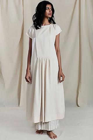 beige pleated & flared shift dress