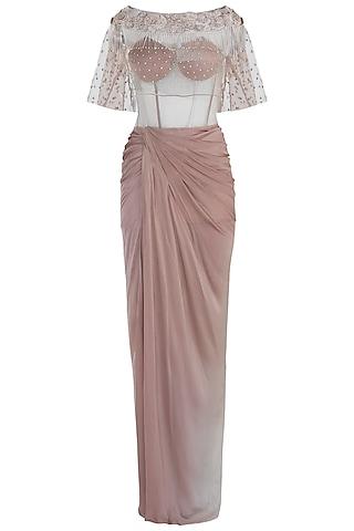 beige pleated gown with embroidered cape