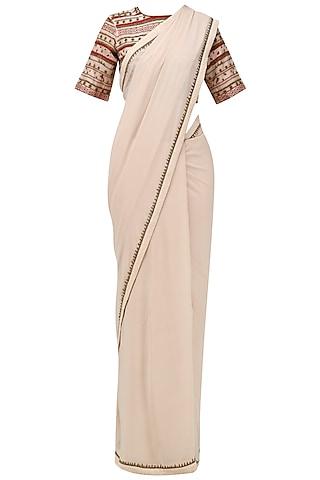 beige saree with embroidered blouse