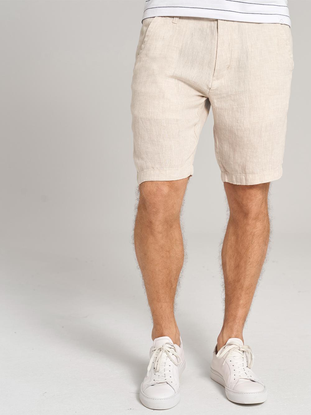 beige solid slim fit shorts