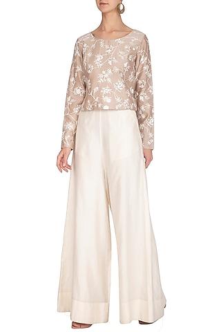 beige thread embroidered boxy top with white pants