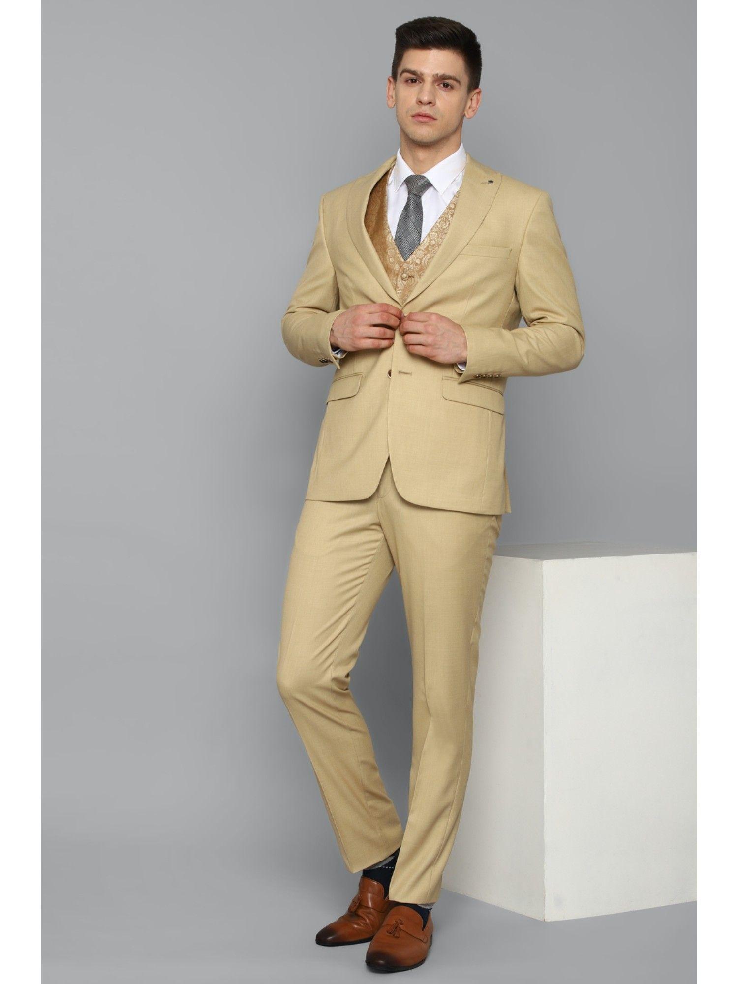 beige three piece suit