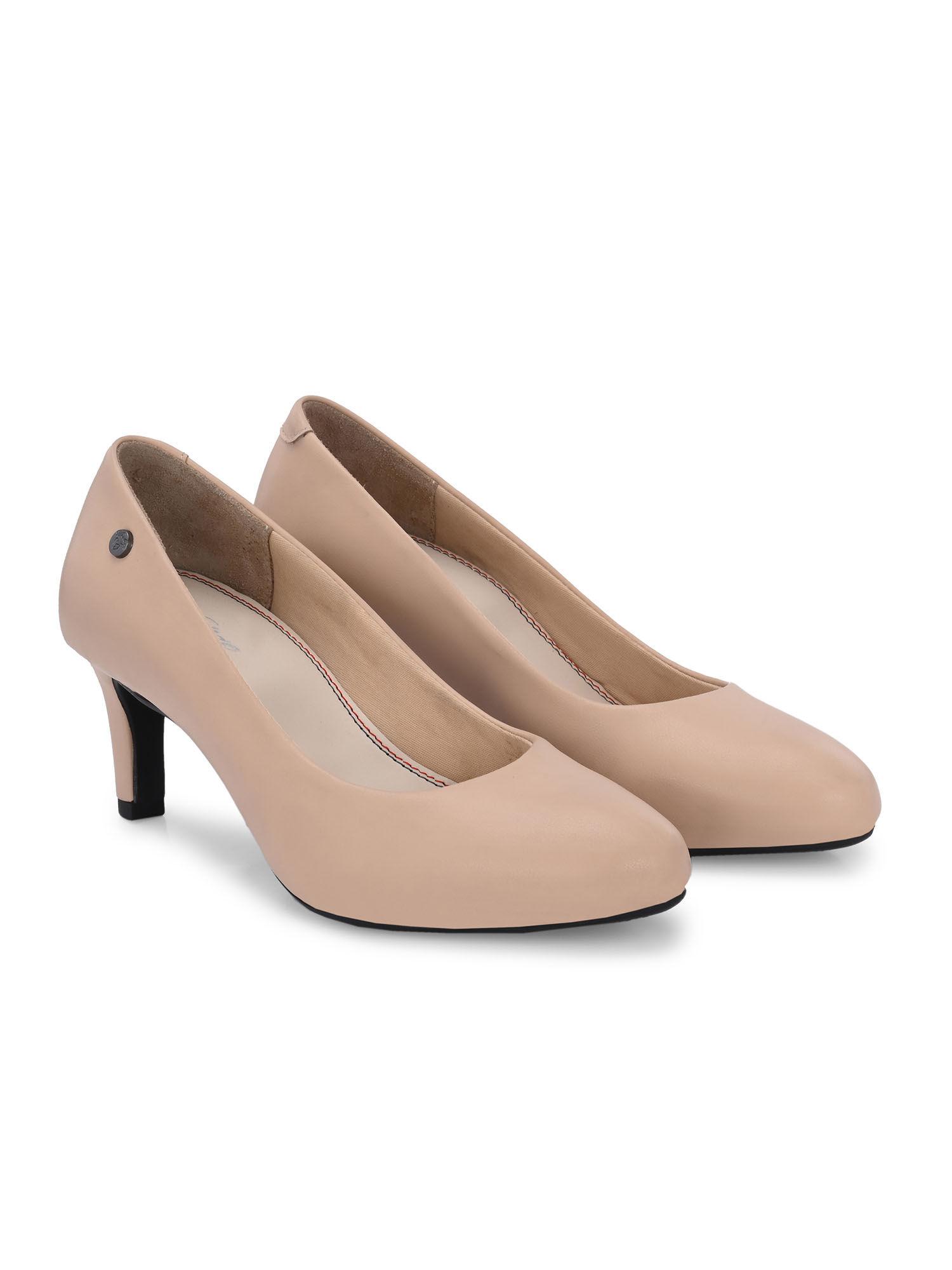 beige women mid heel pumps