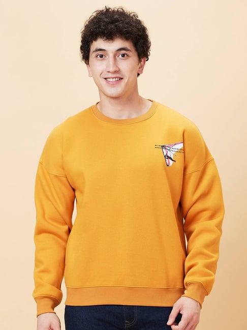 being human orange oversized print sweatshirt