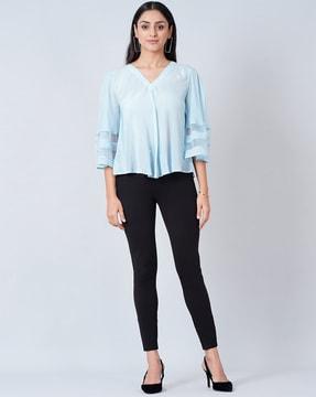 bell-sleeve top with meshed detail