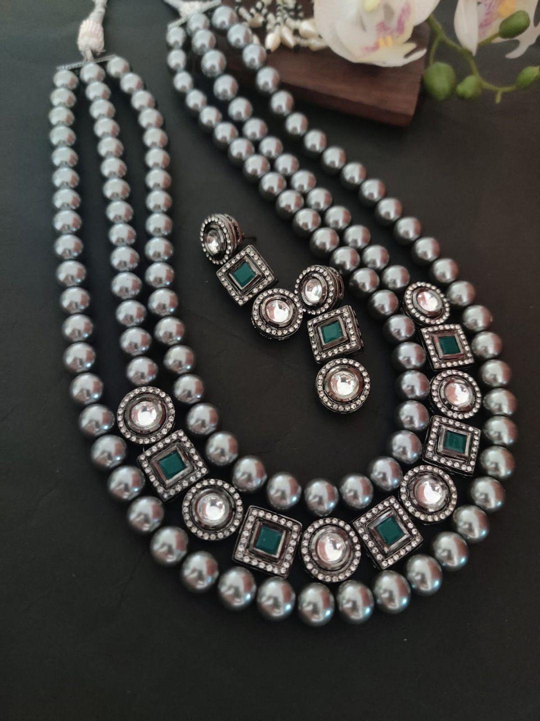binnis wardrobe silver-toned & green three layered jewellery set