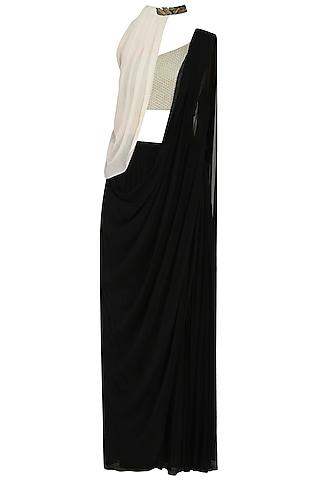 black prestitched saree with off white blouse and cape
