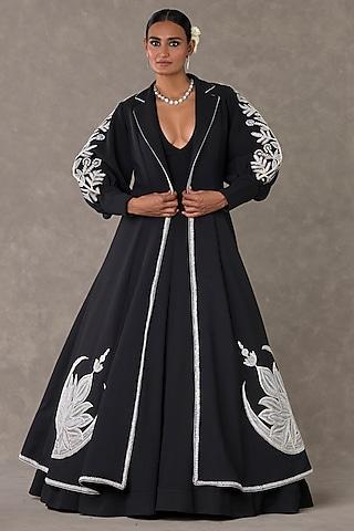 black textured knit gown with embroidered cape