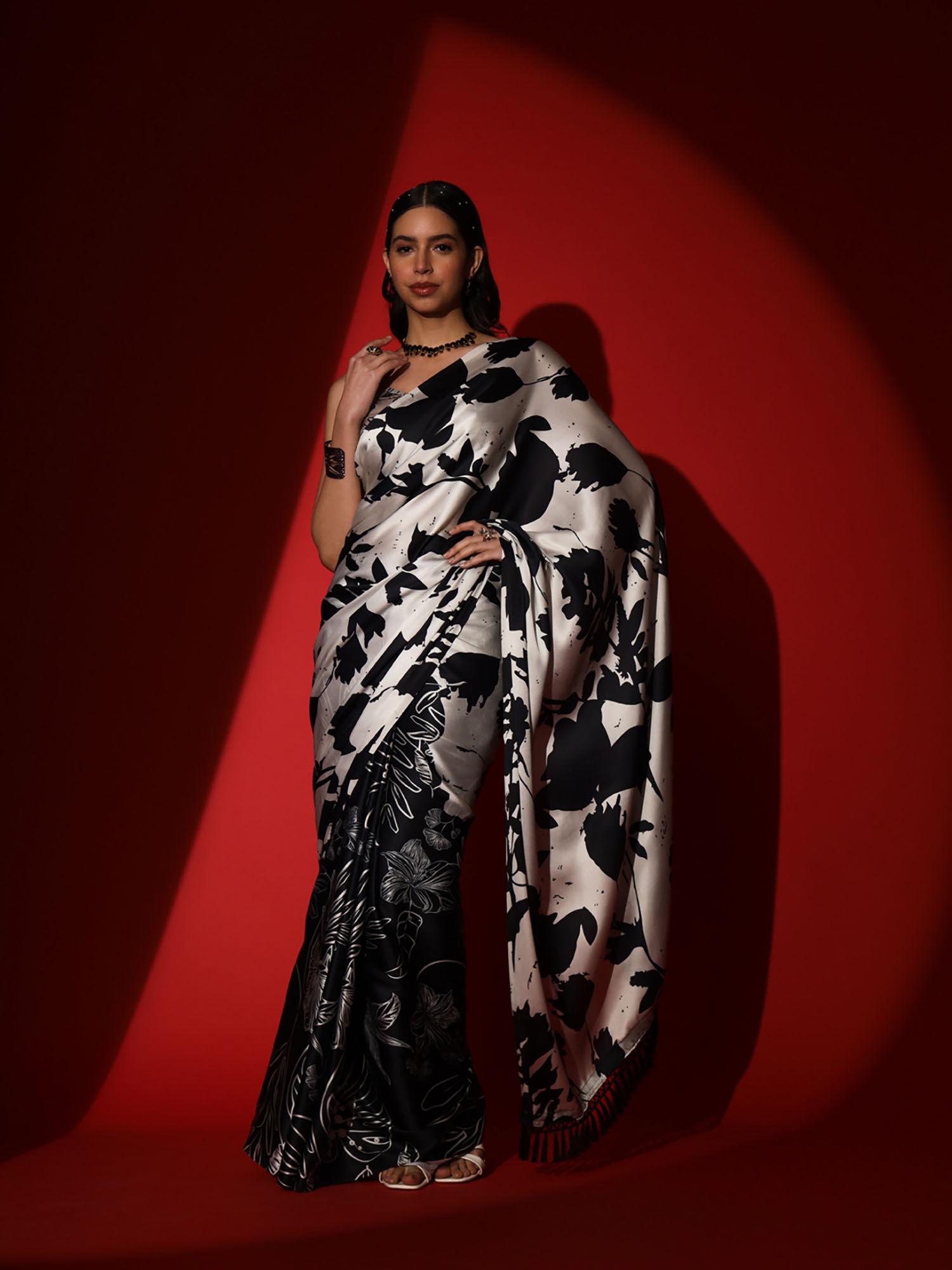 black and cream colored digital floral printed crepe saree with unstitched blouse