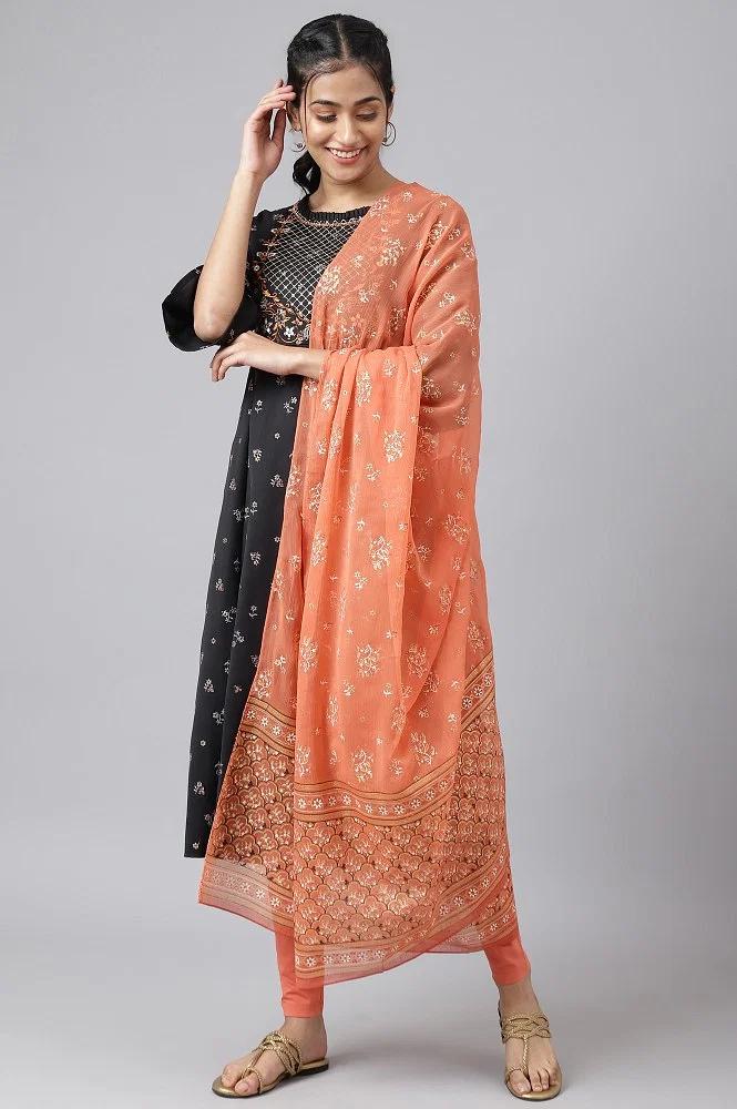black embroidered dress with orange tights and dupatta
