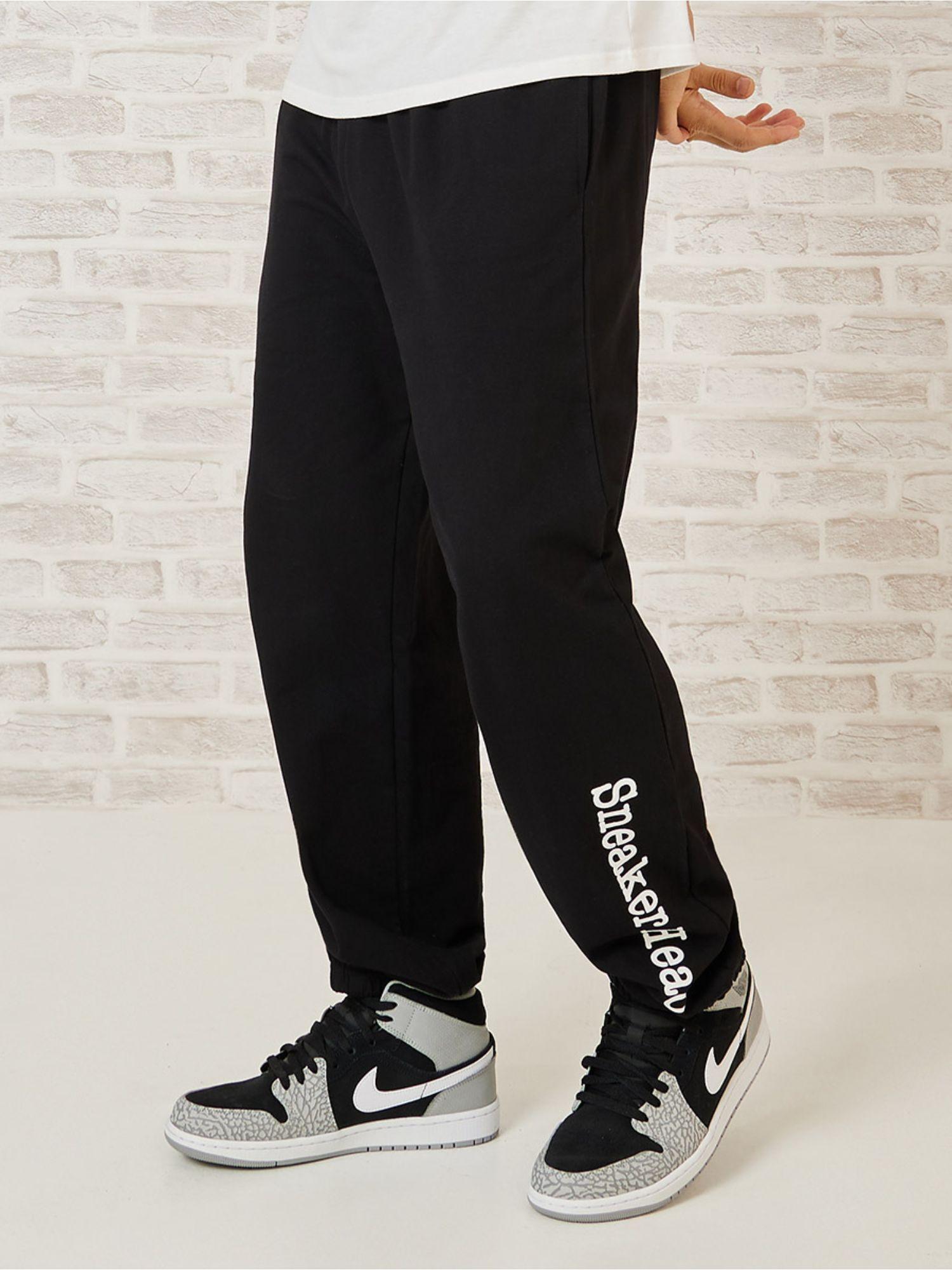 black relaxed fit jogger with bottom hem print