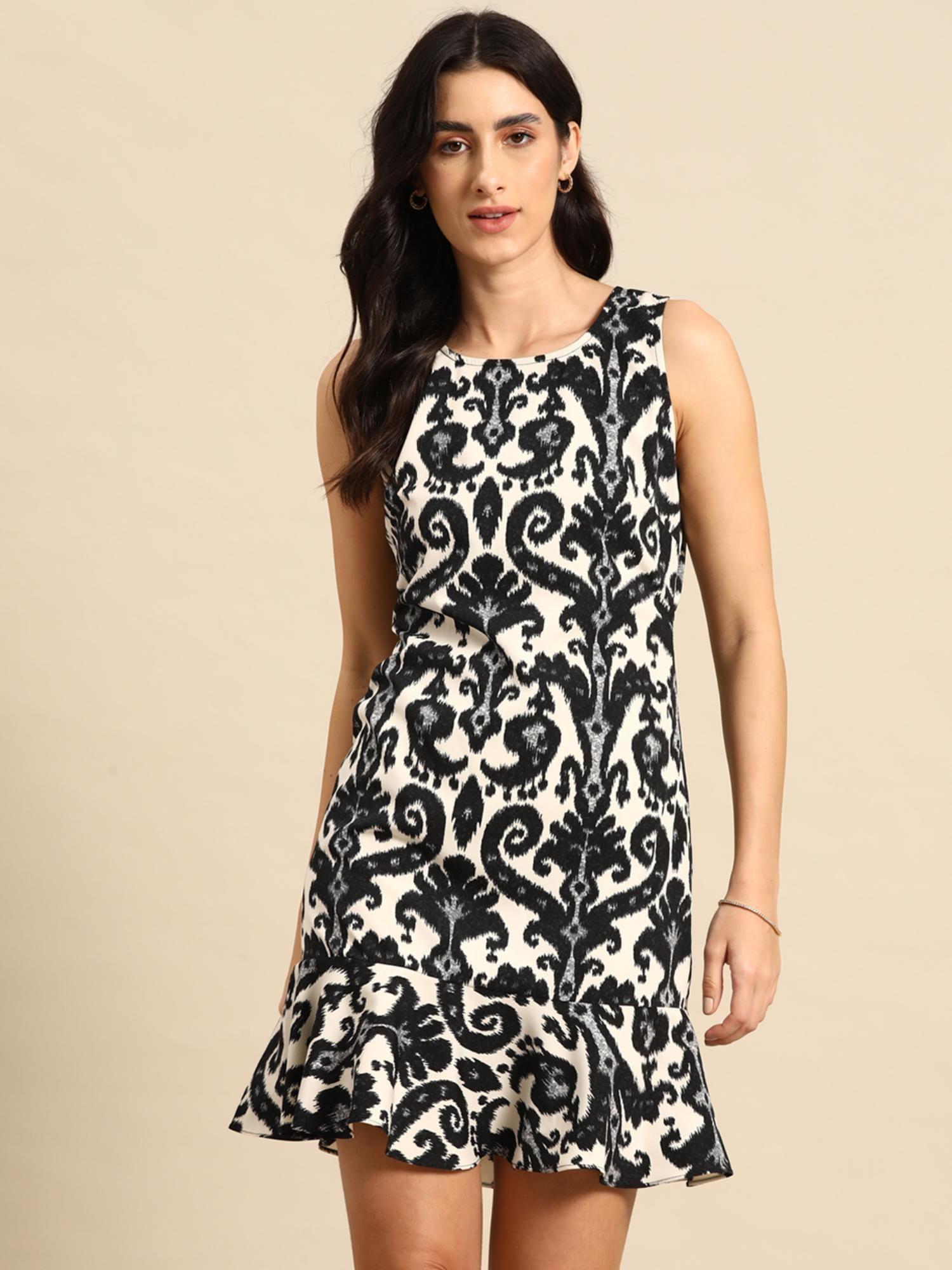 black shift dress with flare at the hem