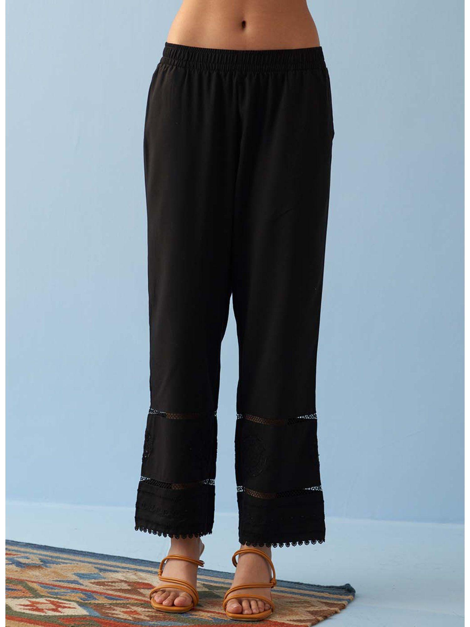 black solid pant with embroidered hem and mesh detailing