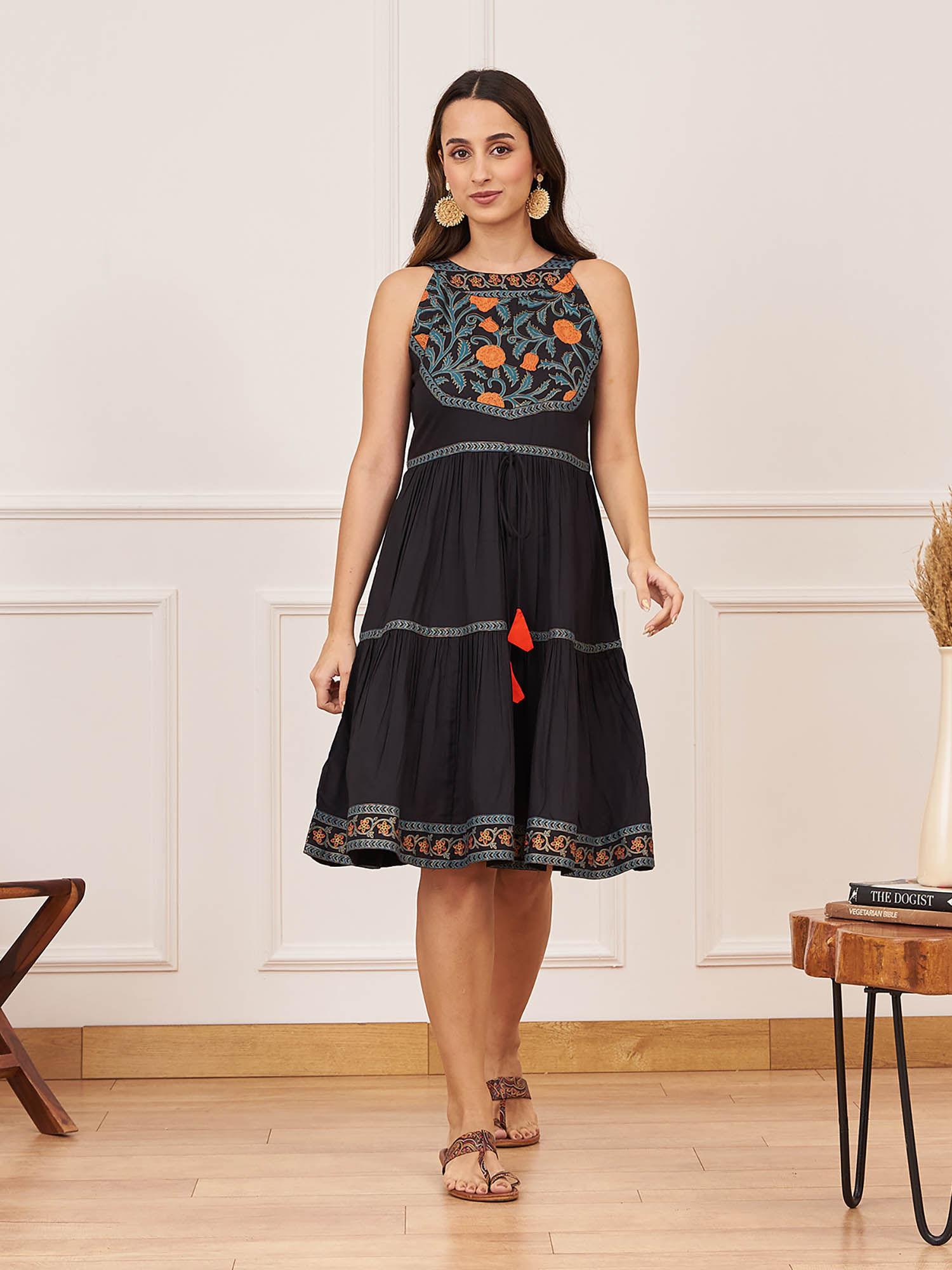 black tiered dress with floral yoke