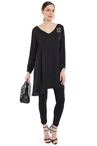 black tunic with broach detailing