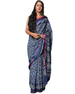 block print saree with pom-pom accent