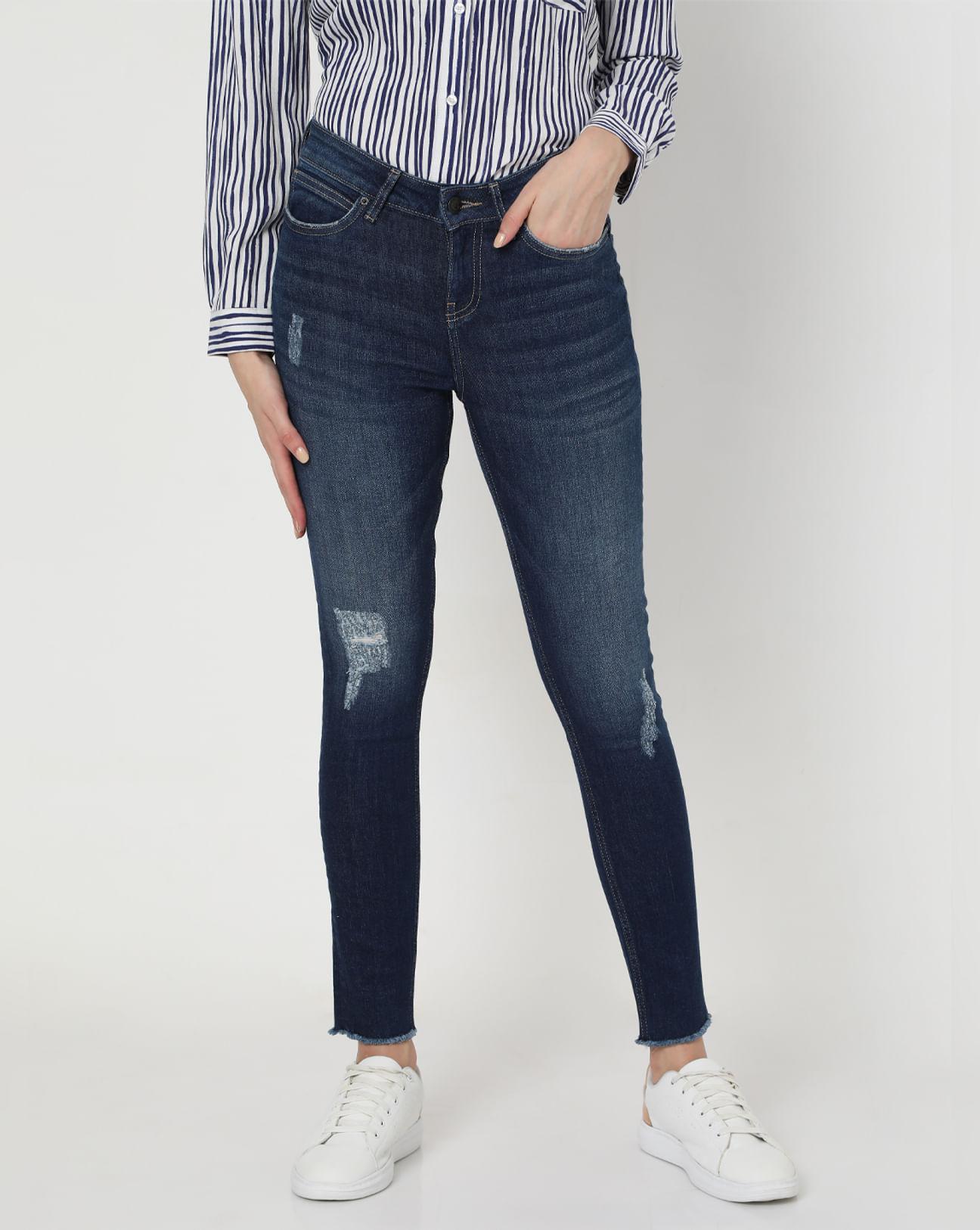 blue mid rise ripped skinny jeans