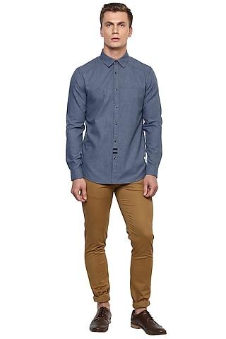 blue shirt with tan elbow patch