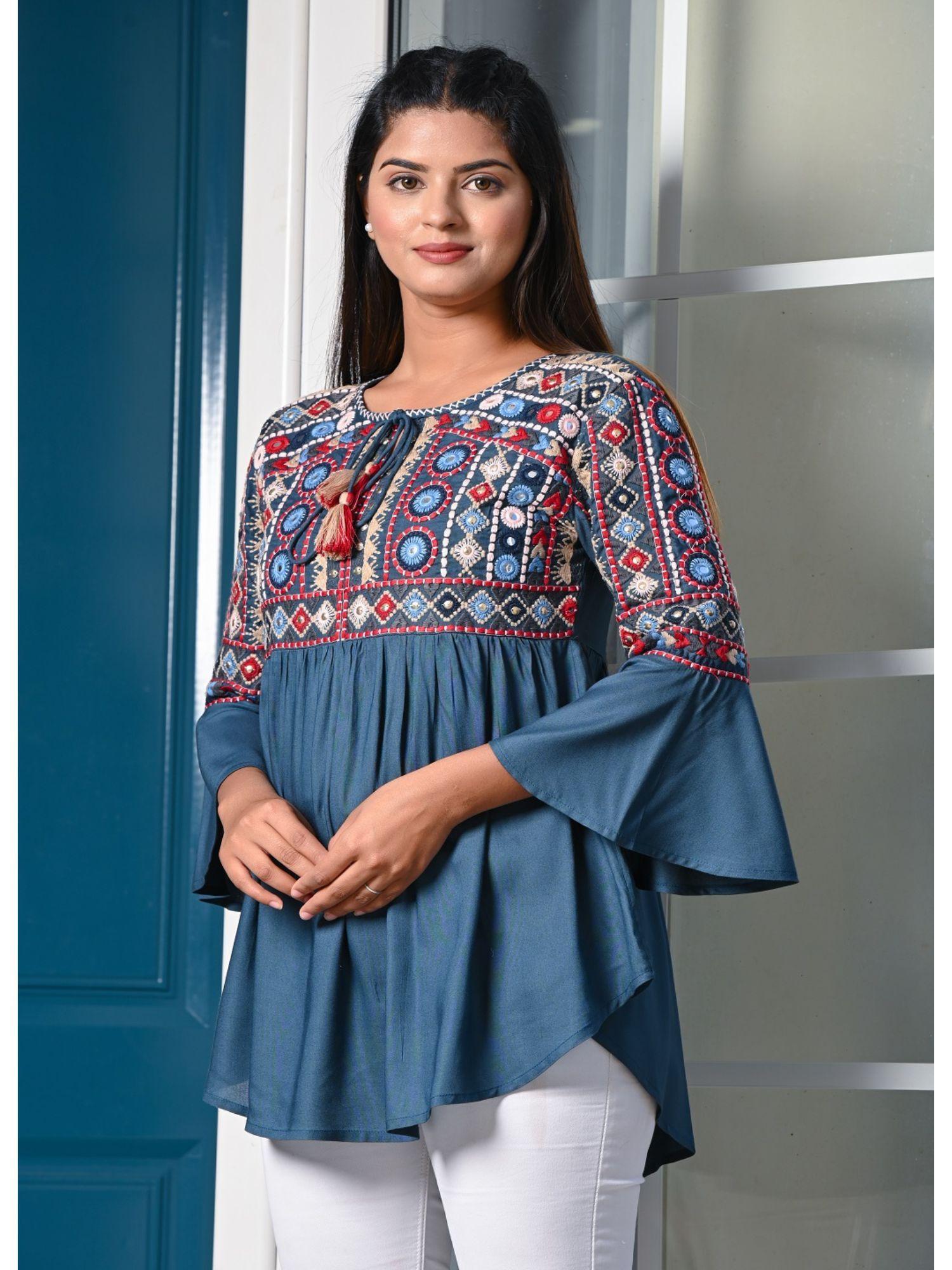 blue peplum embroidered top