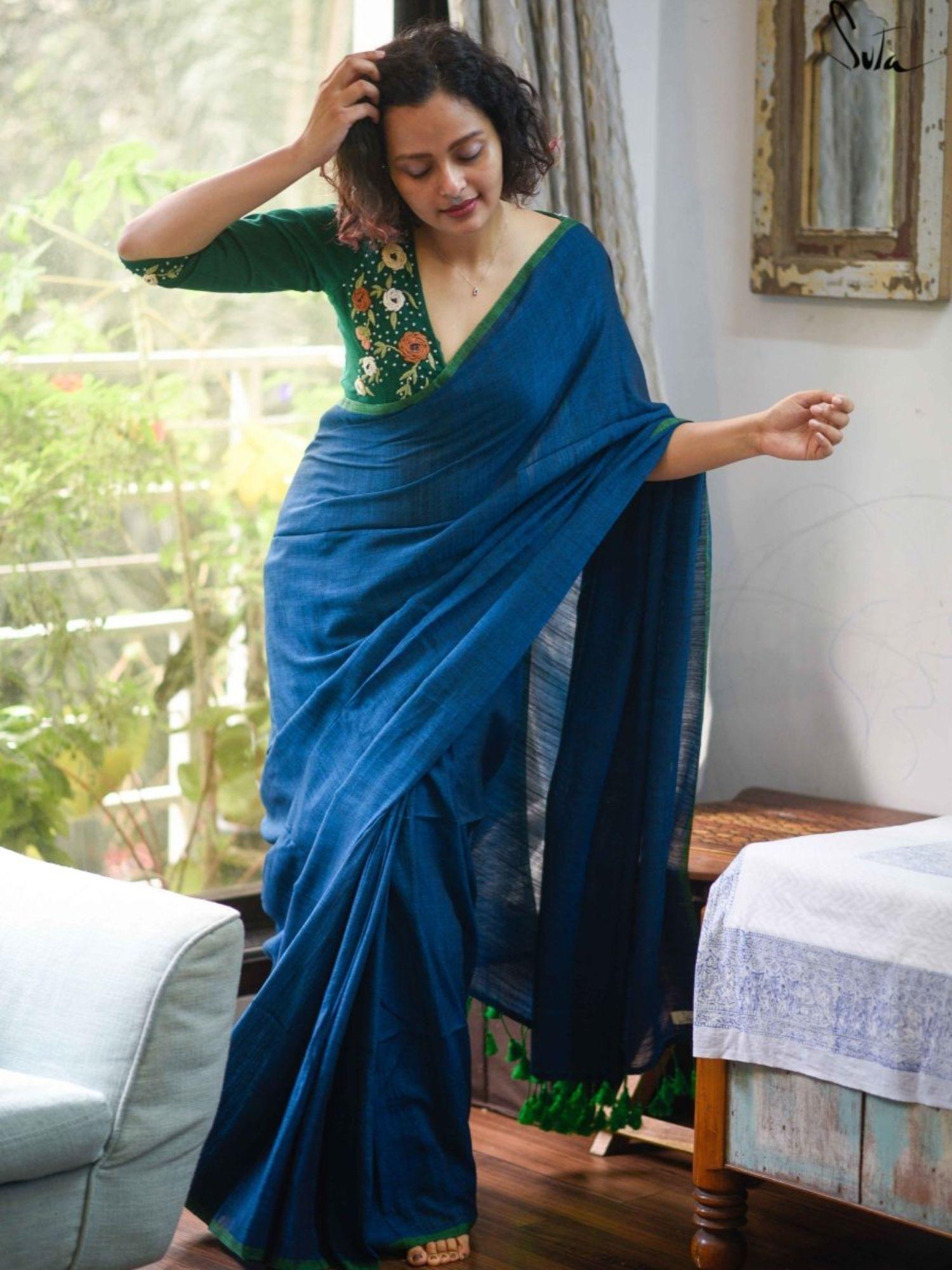 blue solid cotton viscose saree with tassled pallu and without blouse