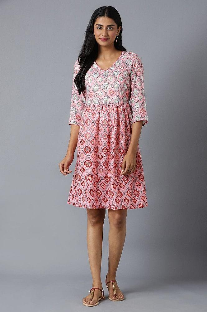 blush pink flared dress in floral print and v-neck